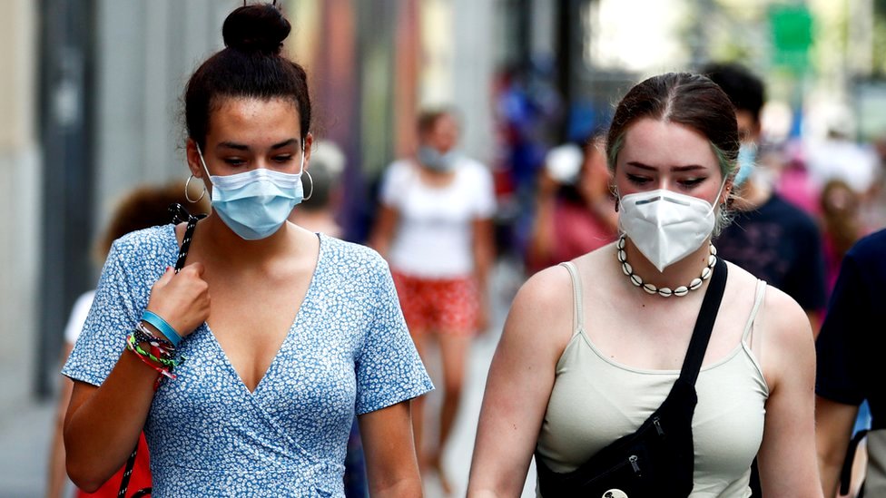 People wear protective masks in the streets of Madrid, Spain, 28 July 2020