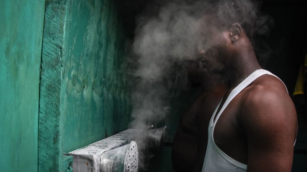 Man inhaling steam in Tanzania