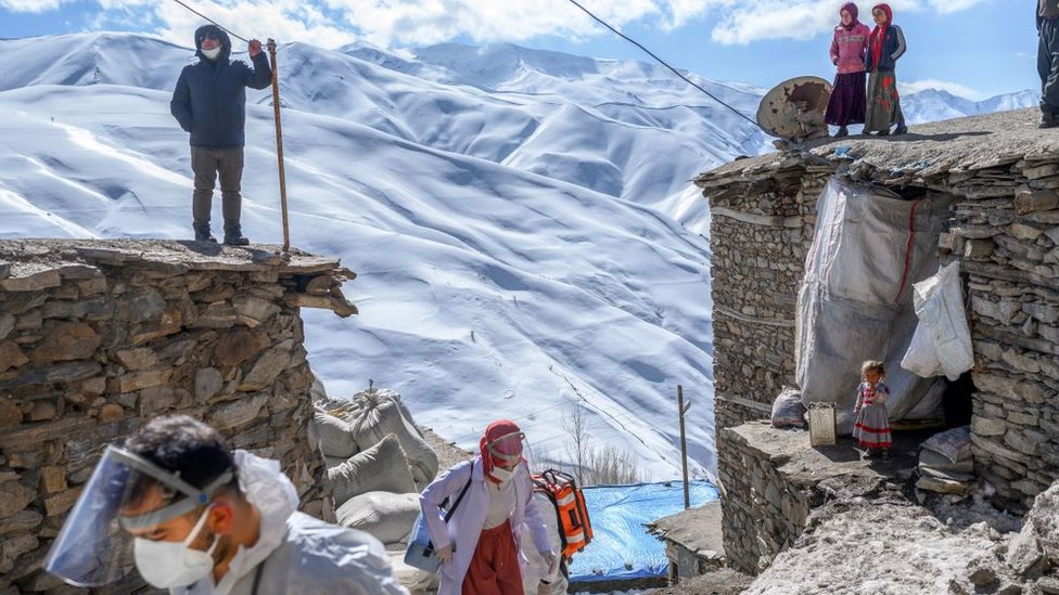 Medical workers arrive at the village of Guneyyamac in eastern Turkey, as part of a vaccination expedition