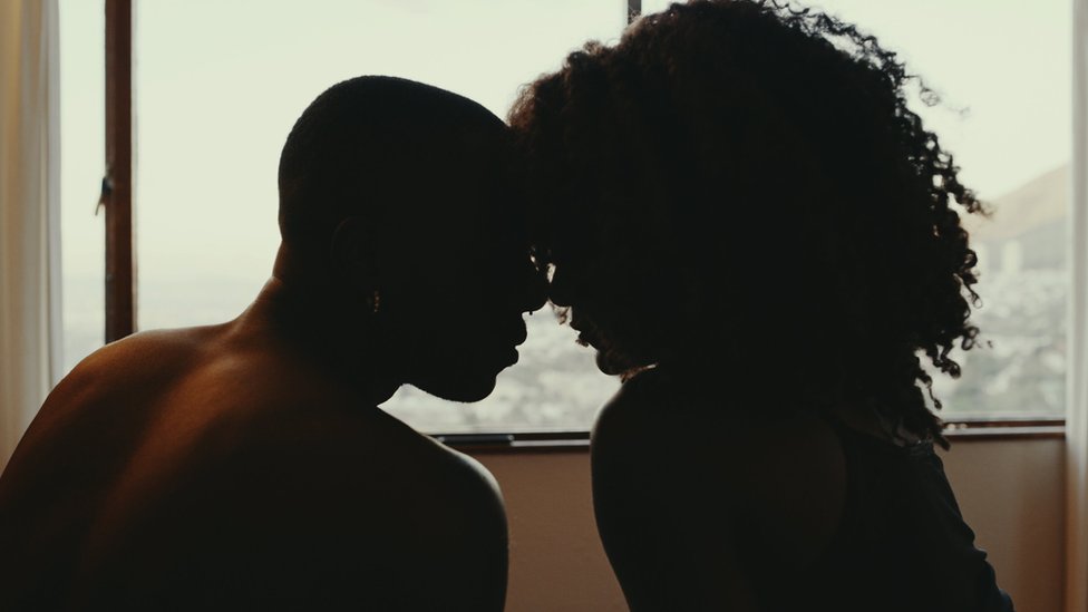 Shot of an affectionate young couple, their foreheads touching as if they want to kiss