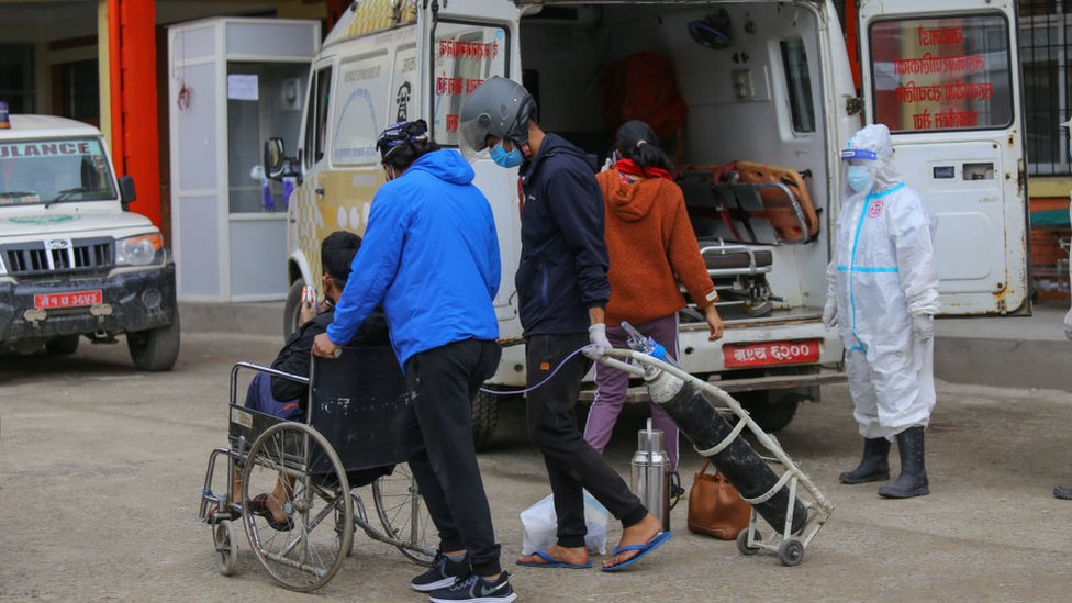 A man infected with Covid-19 arrives at hospital in Kathmandu