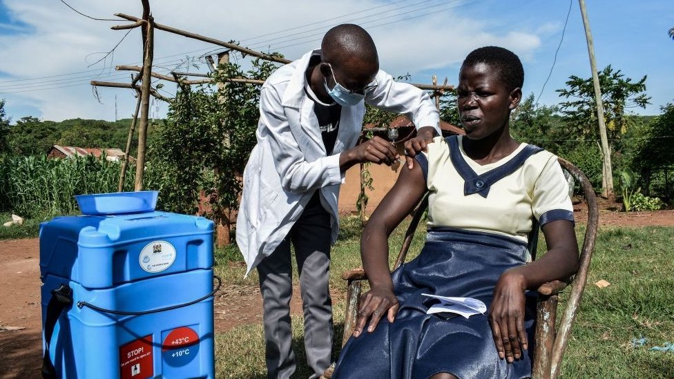 A woman being vaccinated in rural Kenya