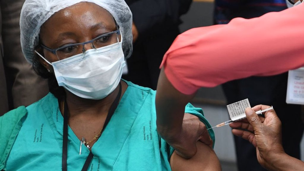 Health worker receiving vaccine in South Africa