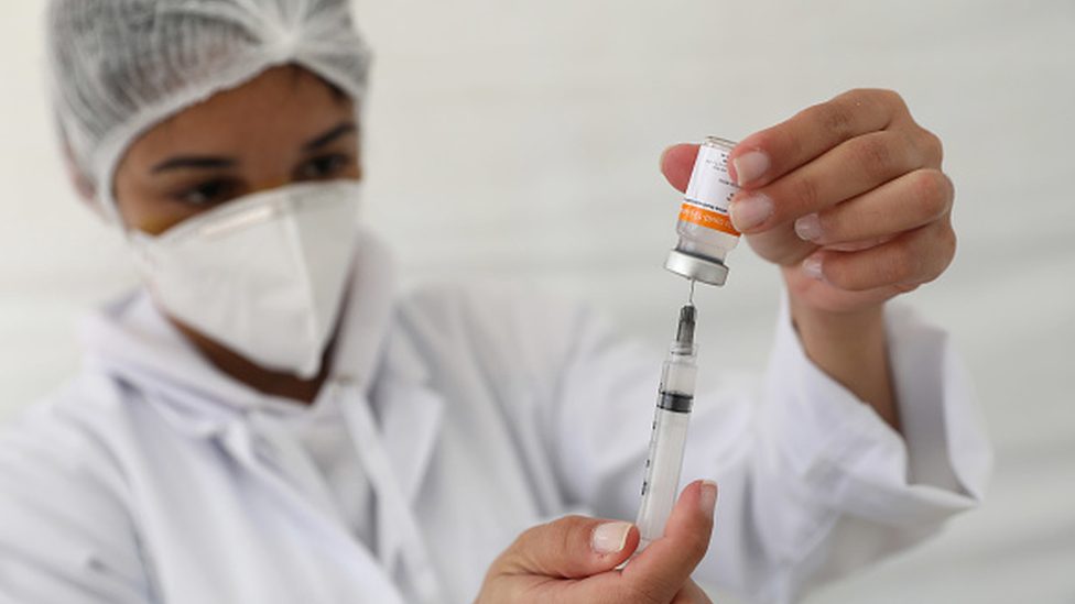 A nurse prepares a Covid-19 vaccine